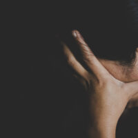 man holding head in distress man holding head in distress